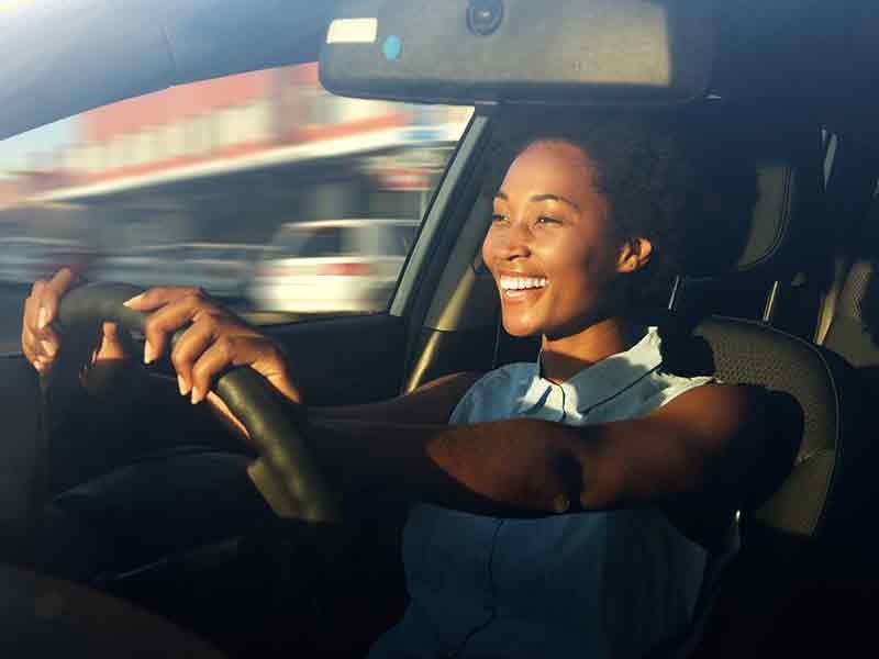 Merced Chevrolet in Merced CA woman driving in her EV