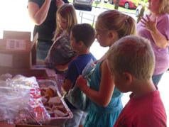 Merced Chevrolet in Merced CA community event photo of kids getting food