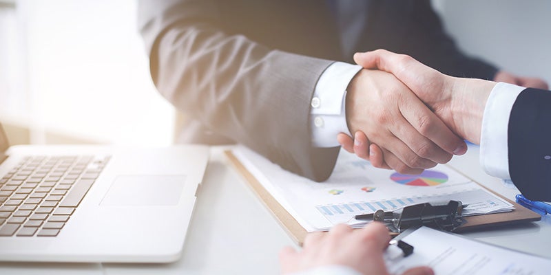 Merced Chevrolet in Merced CA sales rep shaking hand with customer