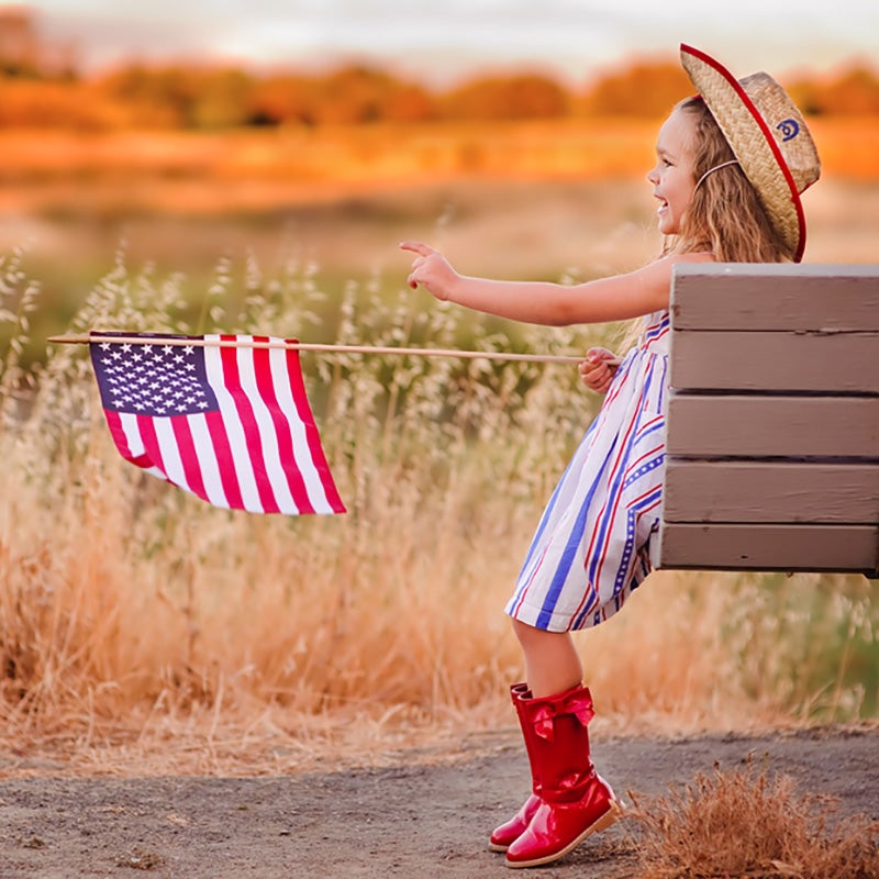 Merced Chevrolet in Merced CA little girl waving american flag