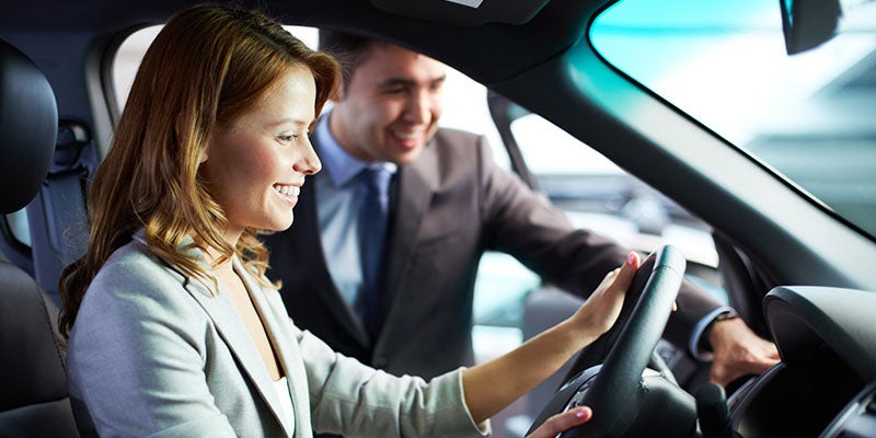 Merced Chevrolet in Merced CA customer sitting in new car